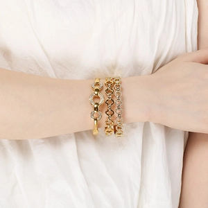Three-piece gold plated stainless steel bracelet set with zircon stones on female wrist