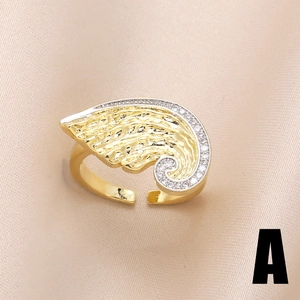 Elegant gold-plated wing open ring with sparkling white cubic zirconia on pink silk