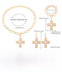 Detailed view of gold alloy jewelry set with cross pendants and pearl accents