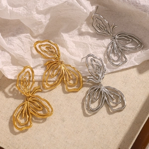 Abstract butterfly hollow earrings in 18K gold and silver finish with lava texture