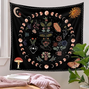 Cozy bedroom scene featuring a black wall tapestry with moon phases and celestial patterns