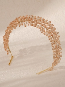 Macro detail of bridal headband with champagne crystal beads and gold wire weaving