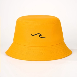 Close-up of bright yellow cotton sun hat with wave embroidery detail and stitched brim