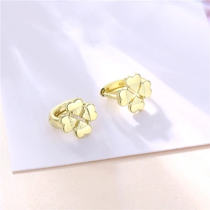 Golden four-leaf clover hoop earrings with heart-shaped petals in minimalist style