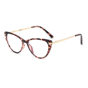 Cat eye glasses frames in tortoiseshell and gold metal shown from a 45-degree side angle