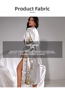 Detail view of silver silk satin robe with elegant gold floral patterns and premium texture