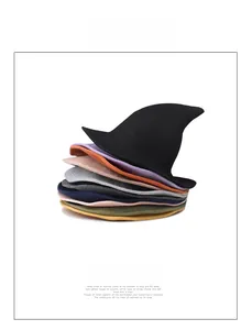 Detailed view of stacked knitted witch hats in multiple colors for Halloween