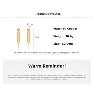 Detail view of gold double oval link earrings showing 1.2cm x 9cm size and 10.7g weight