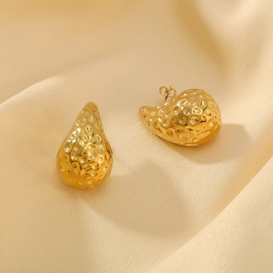 Vintage 18K gold plated stainless steel teardrop earrings with hammered texture on silk