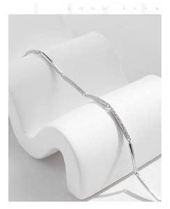 Macro shot of 925 sterling silver chain bracelet with glittering crystals on display