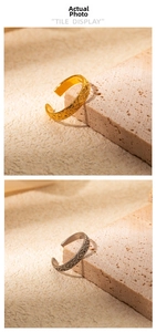 Detail of vintage French style open rings with Baroque patterns in gold and silver