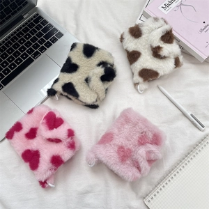 Detailed plush card holders in cow print and heart patterns for organizing small items