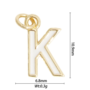 Macro detail of gold letter K pendant with size dimensions 10.9mm by 6.8mm and weight