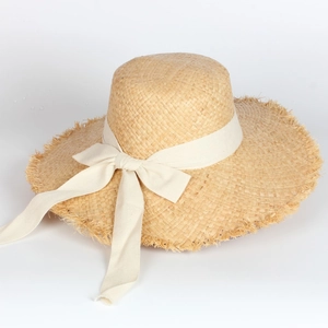 Women's wide brim raffia straw sun hat with large bow and frayed edge detailing