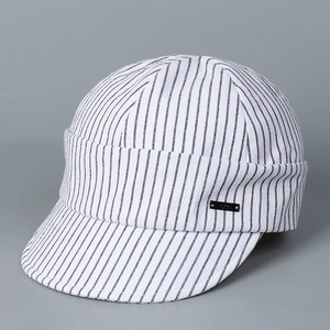 Detailed side view of striped cotton newsboy cap with black 'arth' metal branding