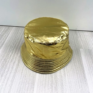 Metallic gold patent leather bucket hat with shiny finish and waterproof PU surface