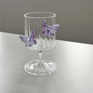 Borosilicate ribbed champagne glass featuring two 3D purple butterfly accents