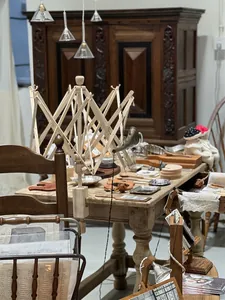 Detail of wooden umbrella swift yarn winder with G-clamp for table mounting