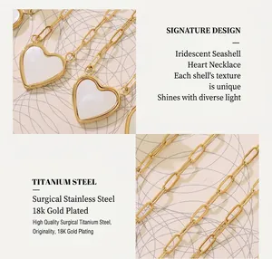 Detail of 18K gold-plated titanium necklace with white shell heart pendant and paperclip chain