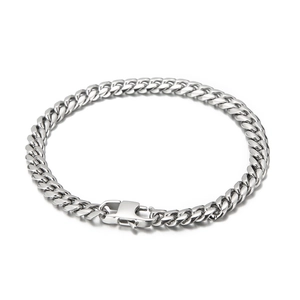 Chunky silver stainless steel Cuban link bracelet with unique clasp on white background