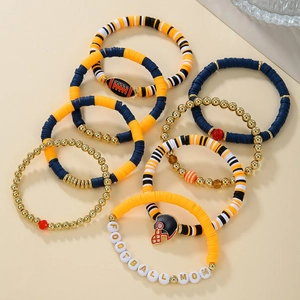 Detail of multi-layer baseball bracelets with football mom charms and heishi beads