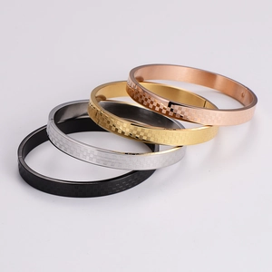 Set of four stainless steel hinged bangles in gold, rose gold, silver, and black finishes