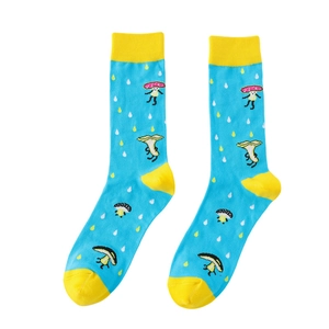 Detail of blue cotton mid-calf socks featuring yellow mushroom patterns and toe accents