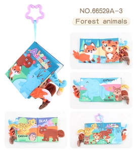 Detail showing sensory 3D animal tails on fabric baby book with a purple star clip