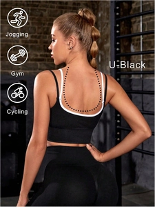 Close-up of black breathable yoga vest featuring a U-shaped open back and racerback design