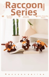 Plush red panda and raccoon stuffed toys displayed on an open book in a cozy setting