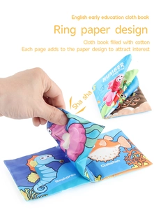 Detail showing baby cloth book with crinkle paper feature and ocean animal illustrations