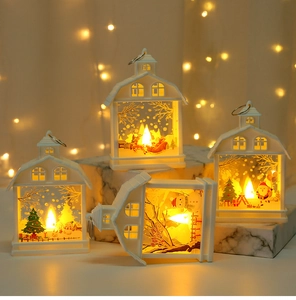 Macro view of white LED Christmas lanterns with festive reindeer and snowman patterns