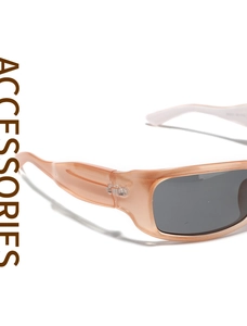 Macro shot of stylish square translucent peach sunglasses frames and dark grey lenses