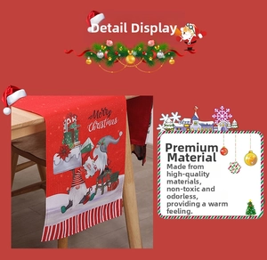Detailed view of Christmas table runner with festive gnome print and Merry Christmas text