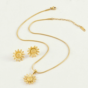 Detail of golden sunflower jewelry set including snake chain necklace and stud earrings