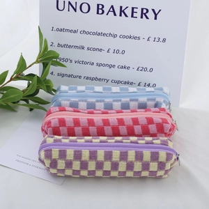 Three-piece checkered knit pencil cases in blue pink and purple with zipper closure