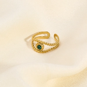 Close-up of vintage 18K gold plated ring with green stone and beaded double layer detail