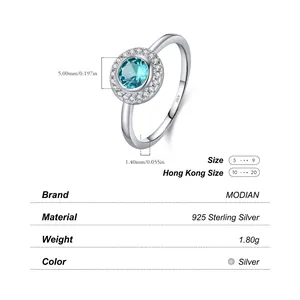 Sparkling S925 sterling silver ring with central round blue gemstone and halo diamonds