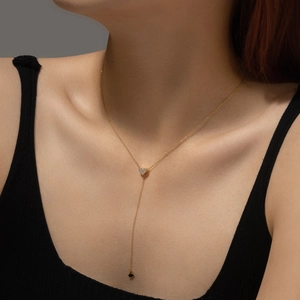 Elegant gold S925 sterling silver Y-shaped heart necklace with cubic zirconia on model
