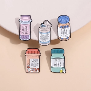 Cartoon enamel lapel pins with inspirational text and colorful medicine bottle designs