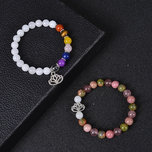 Natural stone bead yoga bracelets with lotus charm and chakra colors on black background