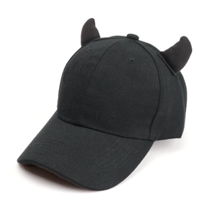 Close-up of black cotton baseball cap featuring 3D devil horns and six-panel crown detail