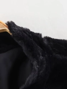 Detailed close-up showing the premium thick black faux fur texture on the jacket collar