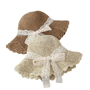Foldable straw sun hats with white lace bow decoration in beige and khaki colors