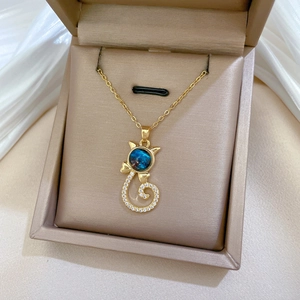Elegant gold cat necklace with starlight blue stone and pavé cubic zirconia