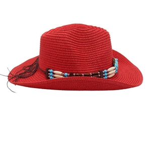 Detail of red woven cowboy sun hat with ethnic blue and white beaded headband trim