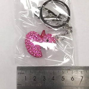 Pink heart rhinestone keychain with lobster clasp shown with ruler for 4cm size measurement
