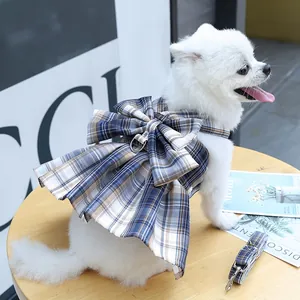 Detail of pet plaid harness dress with large bow and metal D-ring for small dogs