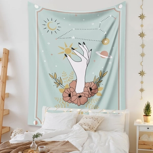 Detail of bohemian sun and moon tapestry with celestial stars over a bedroom headboard