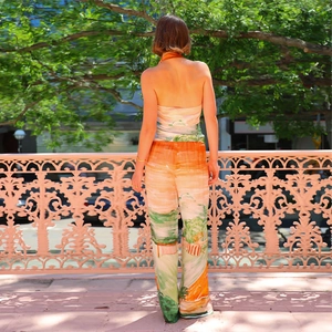 Women's two-piece set featuring a halter V-neck top and high-waisted printed wide-leg pants